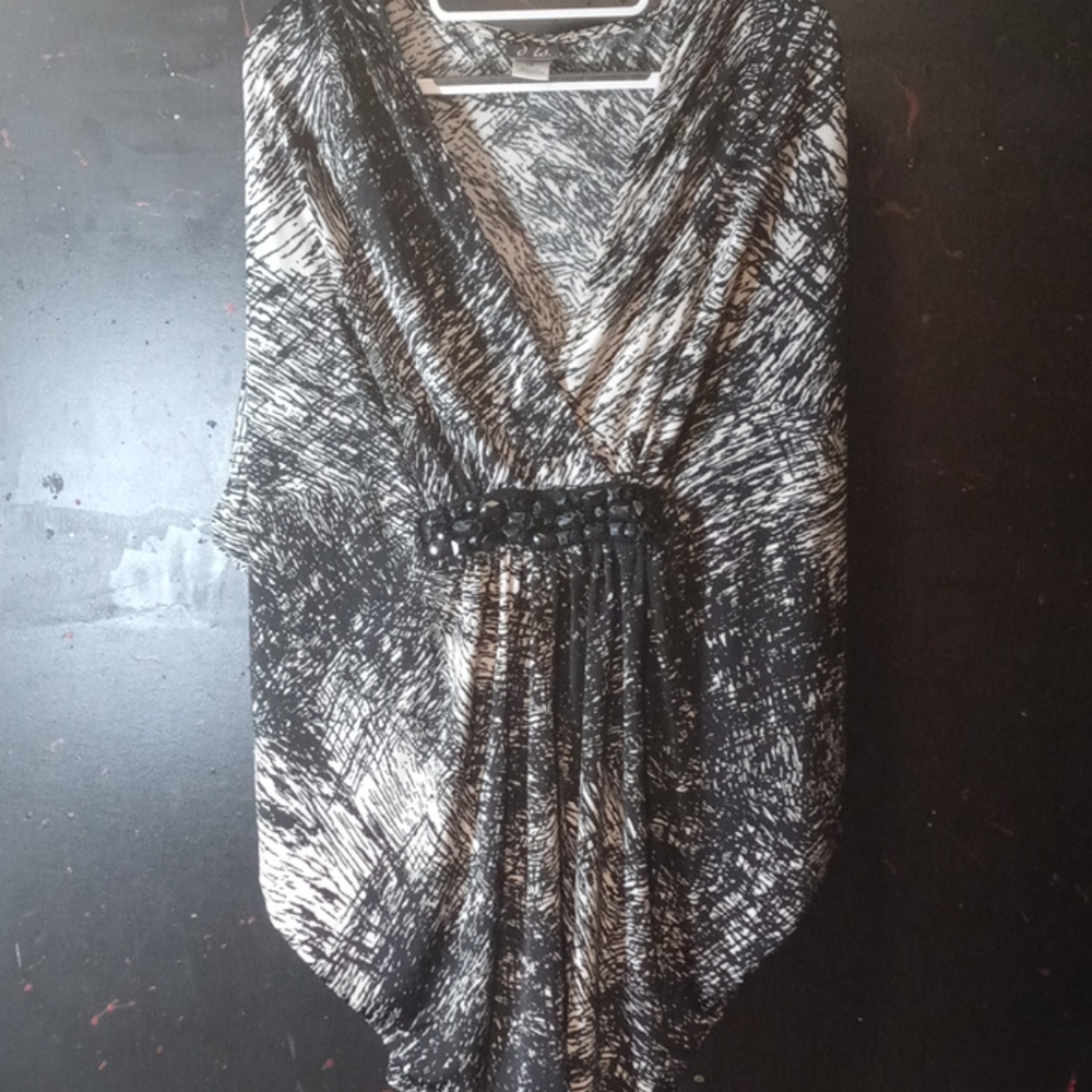 Stretchy black and cream colored shirt